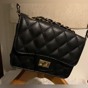 Elegant Black Quilted synthetic leather gold chain bag.